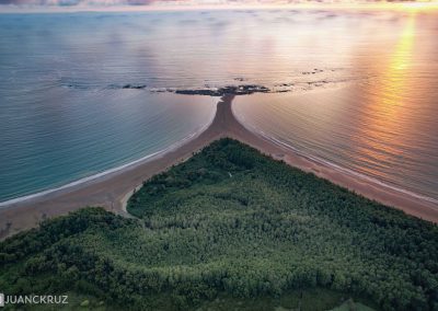 Aerial view during sunset of the "Whale´s tail" of the Marino Ballena National Park, a rock formation in that shaped caused by erosion.